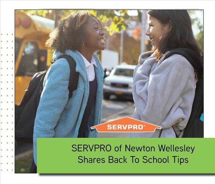 school bus with green text box and orange SERVPRO logo